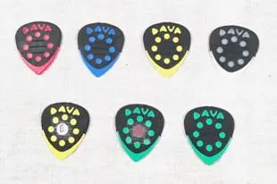 A row of different colored guitar picks with dots.